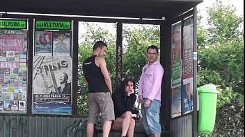 Extreme young busty woman fucked by 2 guys at a bus stop in the middle of a day