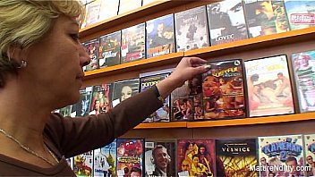 Granny fucks a guy in the video store