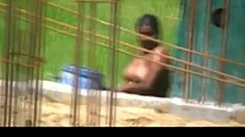 Desi woman caught bathing outdoors